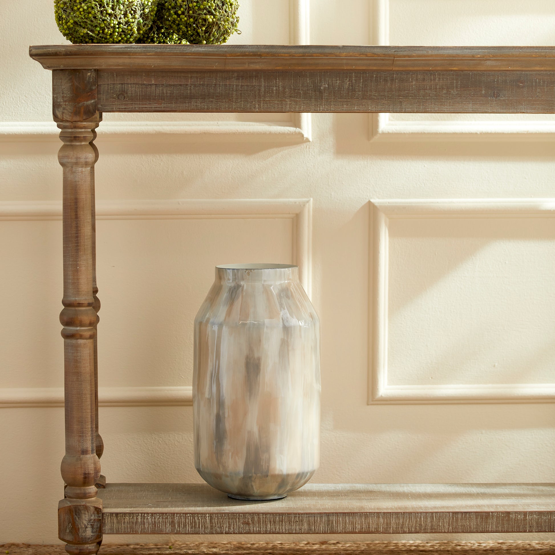 Add a touch of contemporary elegance to your décor with the Almeta White Pearl Decorative Jar Tall. This jar is expertly hand-painted with a delicate neutral tone-on-tone design, showcasing its lightweight enameled iron construction. It is the perfect addition to any modern space, offering sophistication and style in one beautiful piece.