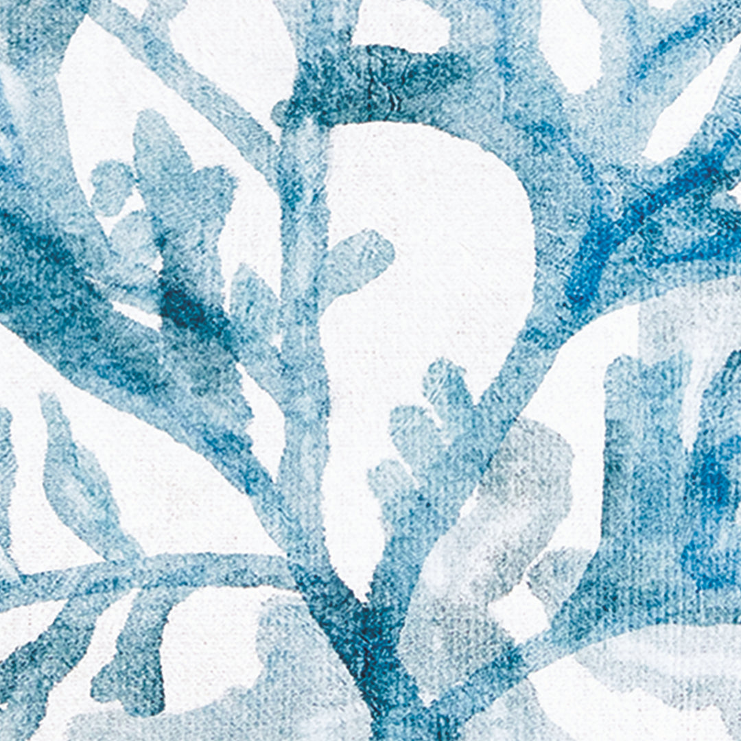 Close view of branching blue coral artwork with layered watercolor-style tones and a softly textured printed surface. Coastal