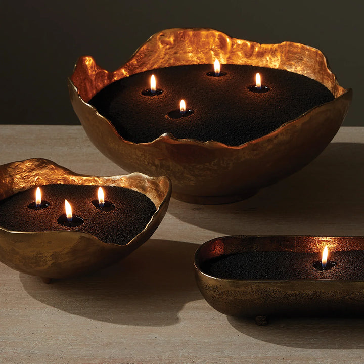 Black candle sand in decorative bowl with multiple wicks creating dramatic ambient glow, refillable candle sand kit for modern styling