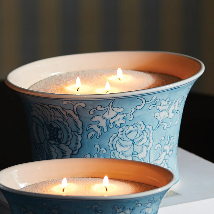 Candle sand refill kit used in blue and white ceramic bowls with multiple wicks creating soft ambient candlelight display