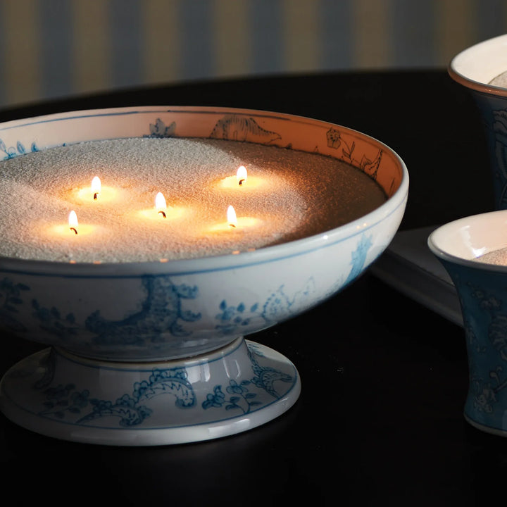 White candle sand in decorative bowl with multiple wicks creating soft ambient glow, refillable candle kit for custom vessel styling