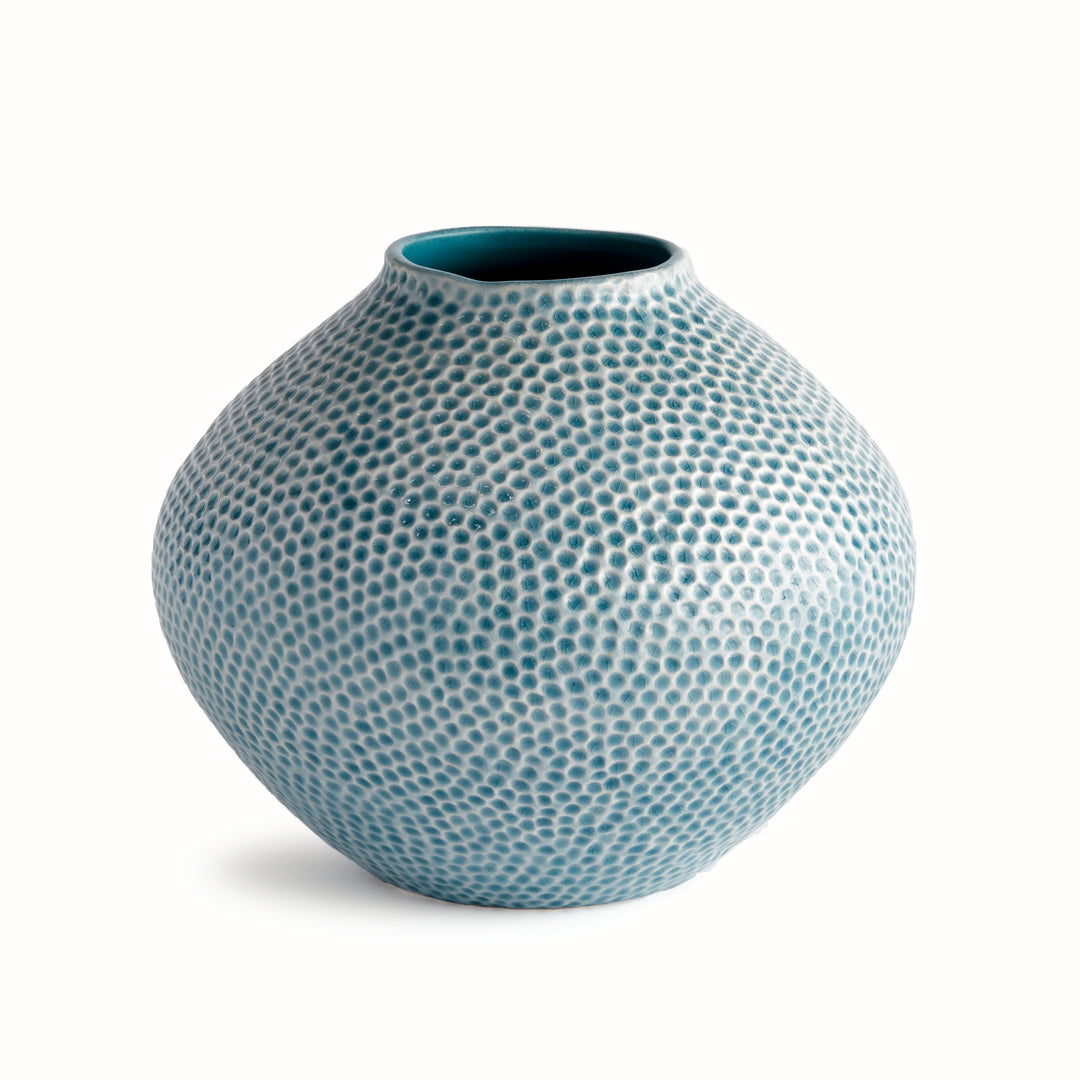 Carys rounded blue ceramic vase with broad shoulders, reactive glaze and a dimpled surface against a pale background. Coastal