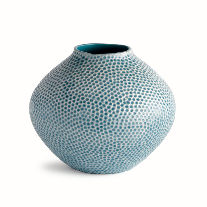 Carys rounded blue ceramic vase with broad shoulders, reactive glaze and a dimpled surface against a pale background. Coastal