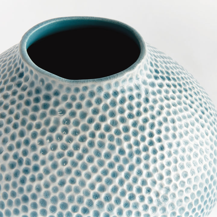 Close view of Carys rounded vase opening with a blue glazed rim and organic dotted texture across its broad shoulder. Coastal
