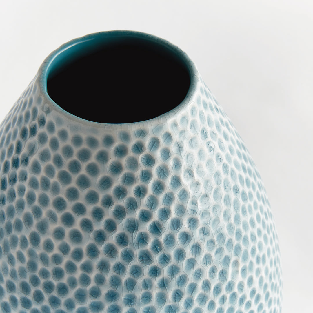 Close view of Carys tall vase neck with dark blue interior and textured blue reactive glaze around the open rim. Coastal