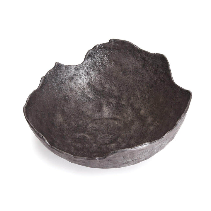 Side view of organic edge bowl in dark cast aluminum finish, styled with neutral background for dining table display