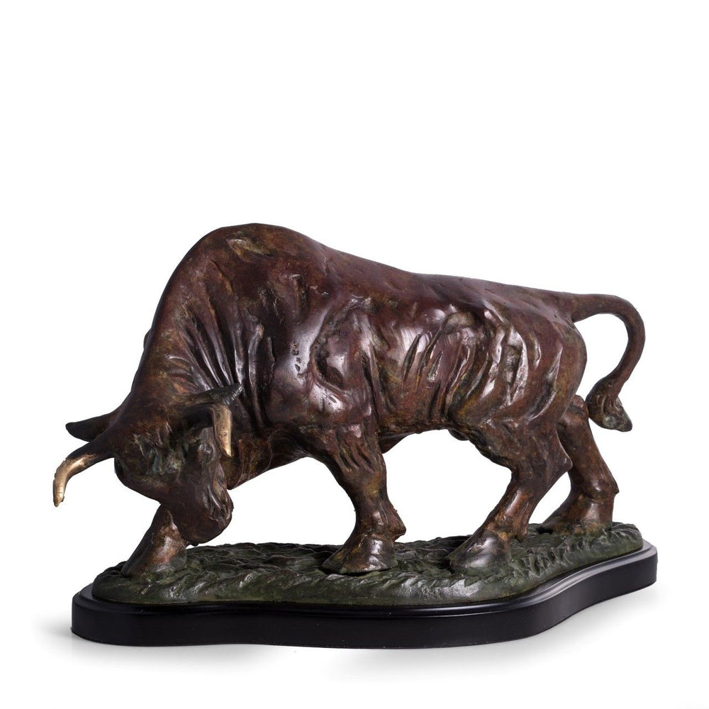 Cast metal bull sculpture mounted on a wood base, forward stance with detailed form and substantial scale for display – Transitional.