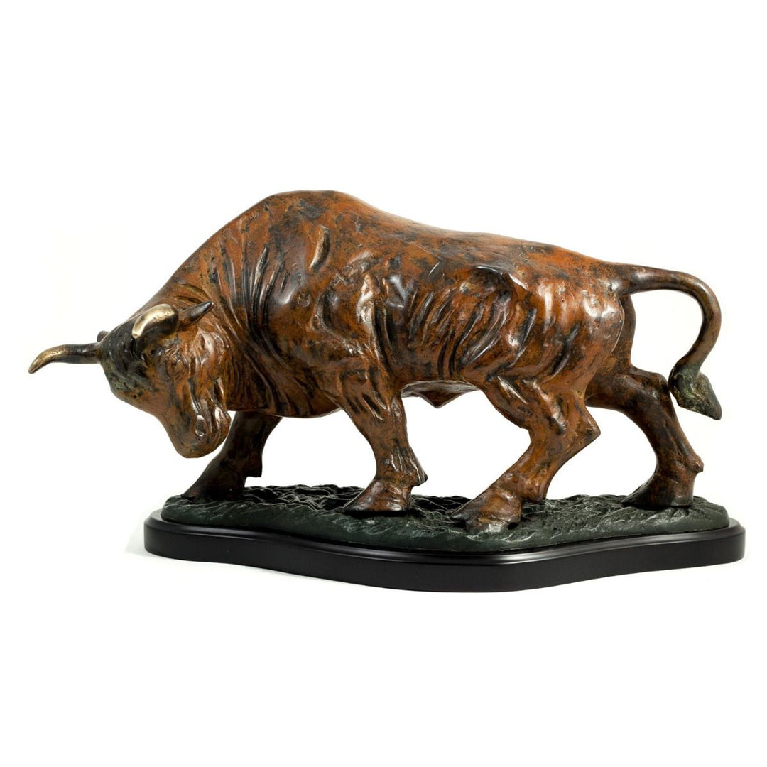 Side view of cast metal bull sculpture on wood base showing flamed patina finish, muscular form, and felt bottom – Transitional.