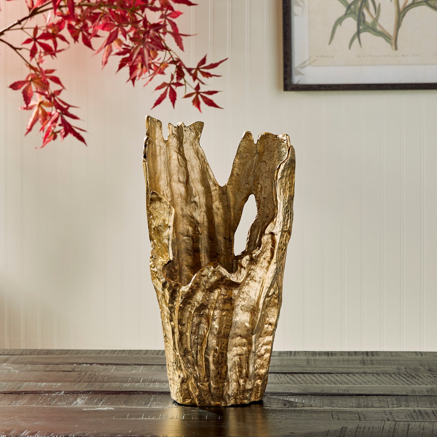 Crafted from durable cast aluminum, our Arbre Gold Vase Large is a beautiful and unique piece of artwork. Its organic, sculptural design makes it a perfect choice for displaying orchids or as a standalone statement in any room. With its intricate details and high-quality material, this vase is sure to elevate the look of any space.