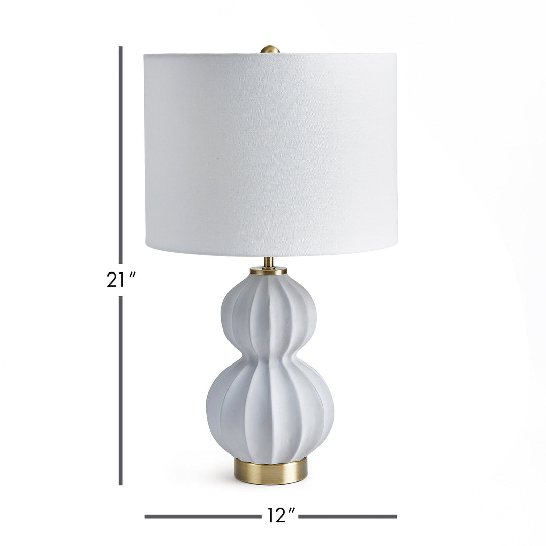 This elegant lamp blends seamlessly into any room, with its traditional yet transitional design featuring a classic natural concrete color and curvy shape. Its generous linen shade adds a touch of luxury, perfectly complementing the antique bronze accents