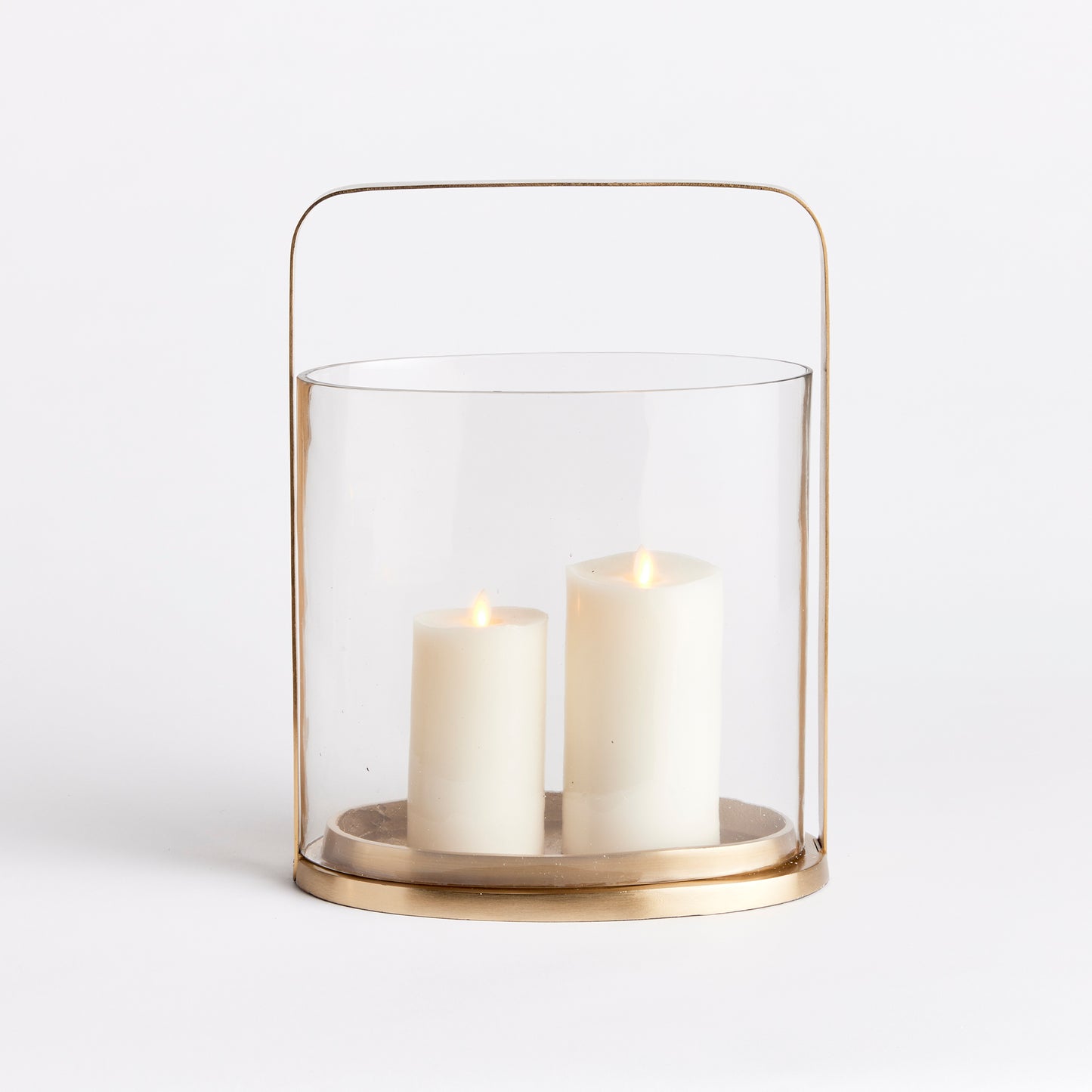 Crafted with a rare oval shaped glass hurricane, this candleholder is truly a masterpiece. Its simplistic design and warm matte brass details enhance its appeal. Expertly crafted and uniquely designed, the Aila Oval Hurricane Candle Holder is a stunning addition to any home decor, providing an elegant oval shape and a touch of sophistication with its warm matte brass details. This candleholder is the perfect blend of art and functionality.