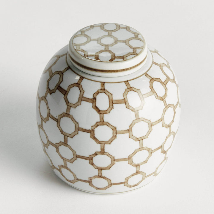 Round ceramic lidded jar in brown and white with geometric link pattern, shown at an angled view to highlight shape and design.