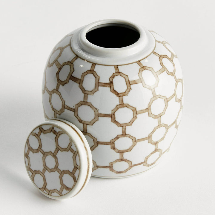 Ceramic lidded jar with geometric link pattern in brown and white, shown with lid removed to reveal interior, decorative round design.