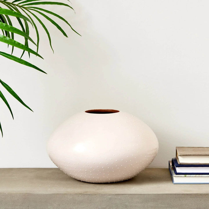 Small and large ceramic round vases in off-white glaze with stippling, styled on console with florals – Modern Organic


