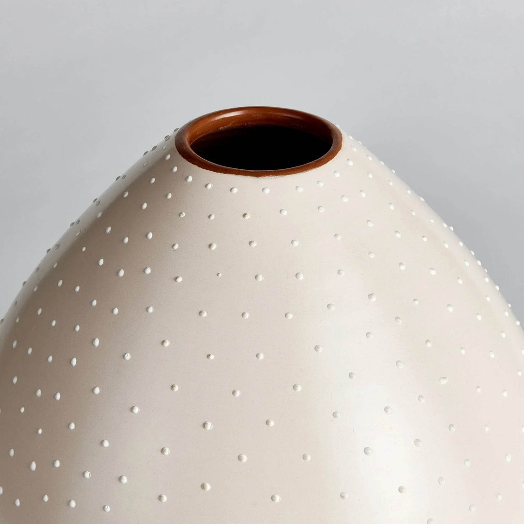 Close-up of terracotta interior rim and stippled texture on off-white ceramic teardrop vase – Modern Organic




