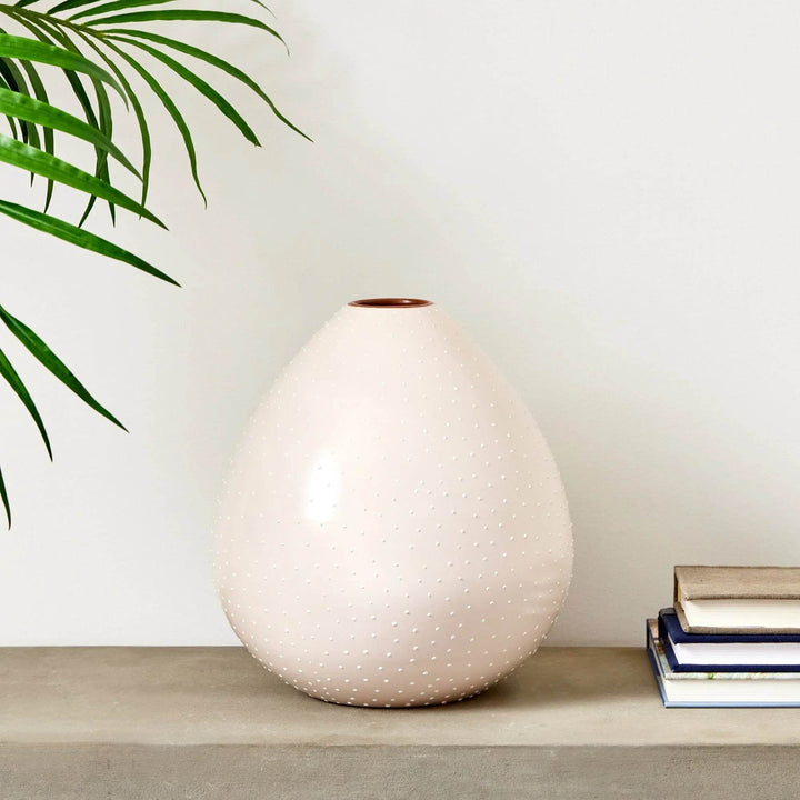 Large off-white ceramic vase styled on shelf with books and indoor palm leaf – Modern Organic


