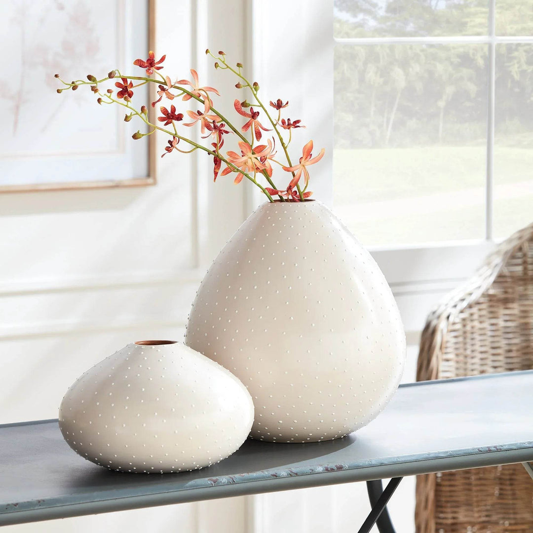 Large and small ceramic teardrop vases in off-white with stippling, styled on blue console table – Modern Organic

