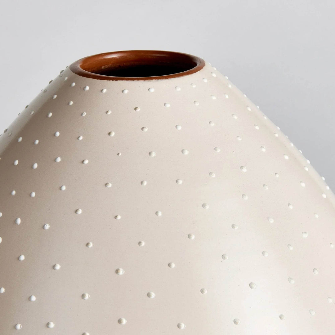 Detail of handcrafted stipple pattern on matte off-white ceramic vase surface – Modern Organic

