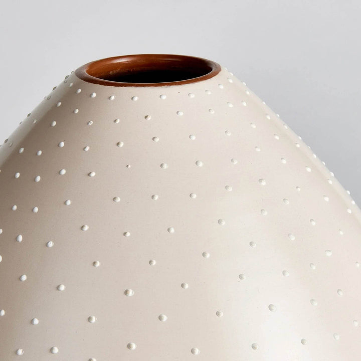 Detail of handcrafted stipple pattern on matte off-white ceramic vase surface – Modern Organic

