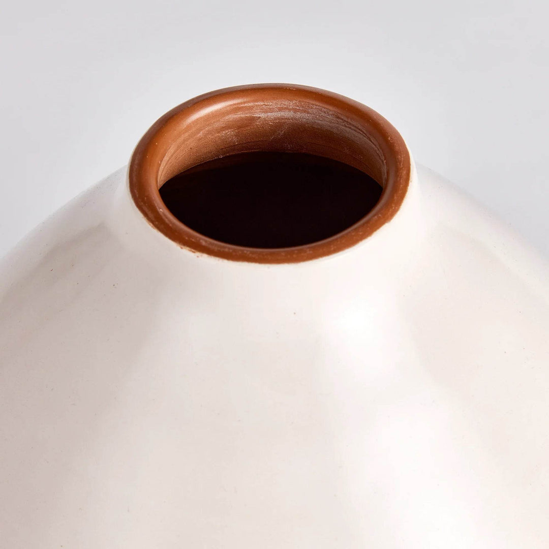 Overhead view of ceramic vase opening with polished clay lip and curved contours – Modern Organic