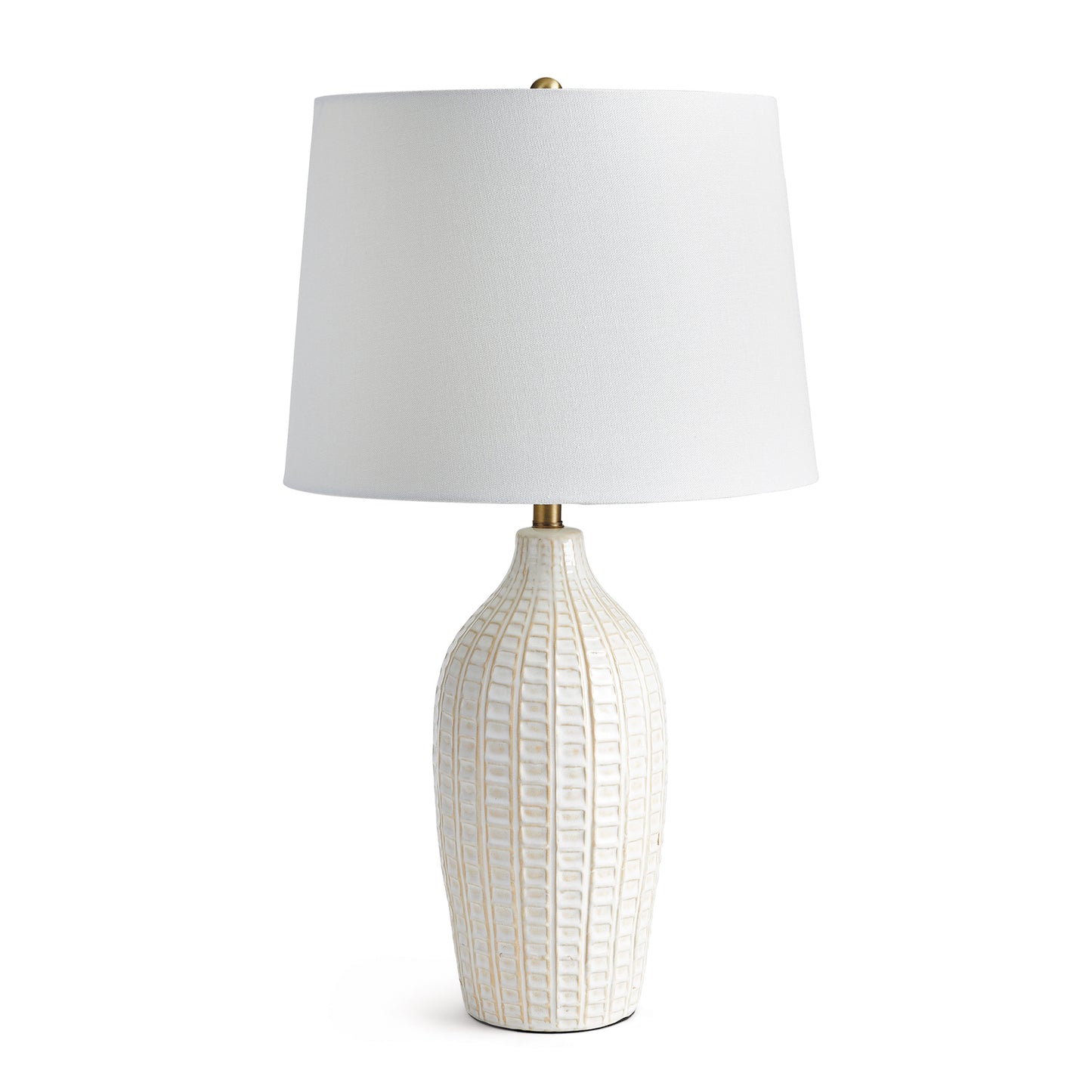 With a pressed pattern on the ceramic body, the Nadia Lamp is a work of art. Topped off with a generously scaled fabric shade, it is sure to enhance any space.