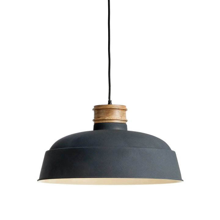 Charcoal and mango wood pendant light with wide industrial dome shade, suspended against white background – modern organic style.