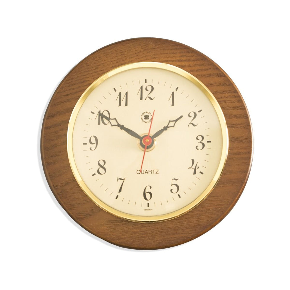 Cherry wood brass wall clock with cream dial shown front view for traditional office shelf decor style