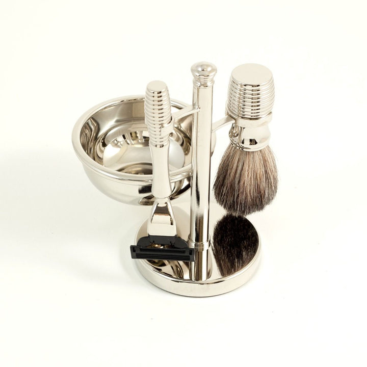 Chrome razor and pure badger brush four-piece shave set with bowl and stand, heavy base for stability and daily men’s grooming.