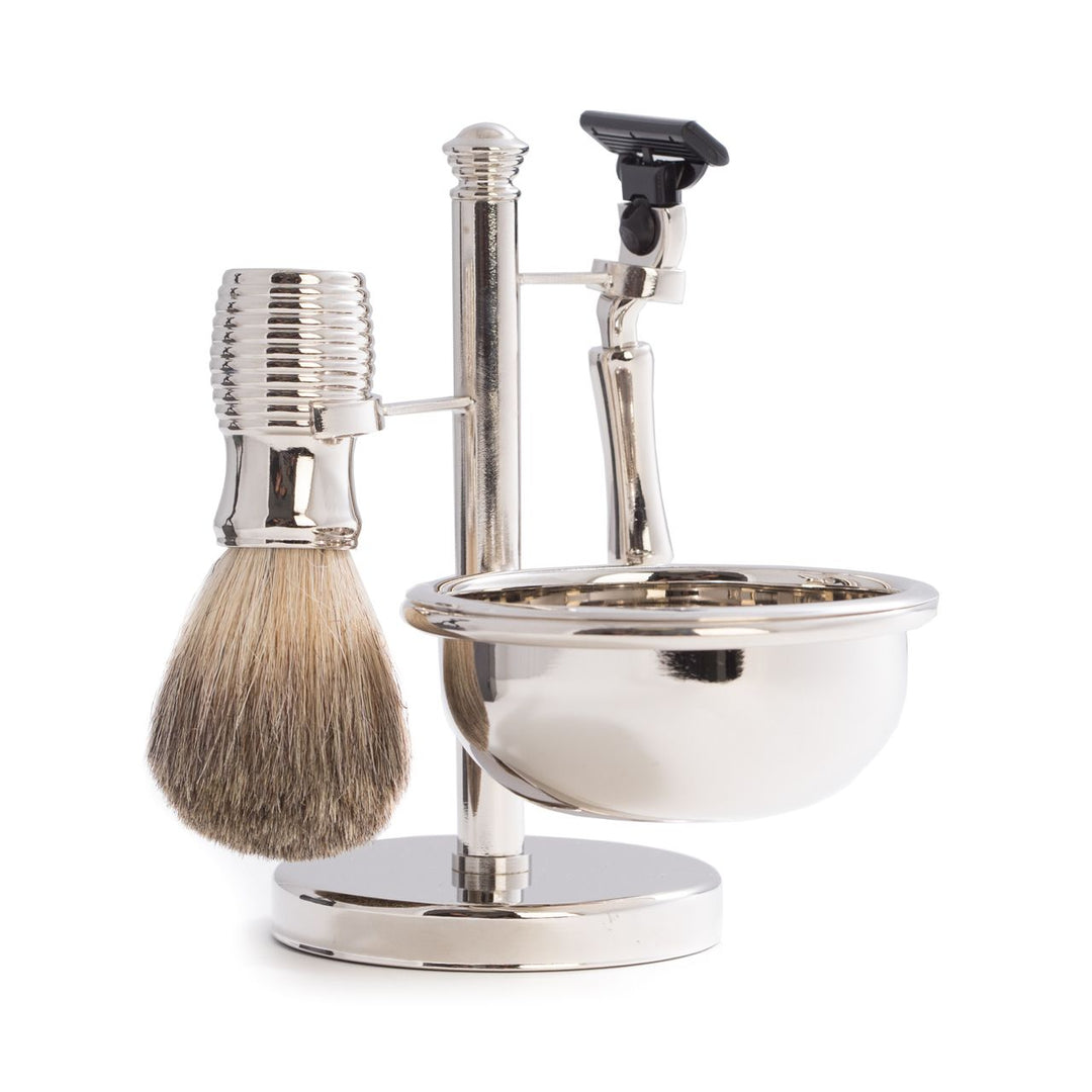 Side view of chrome razor and pure badger brush four-piece shave set with bowl and stand, tarnish-resistant silver finish.