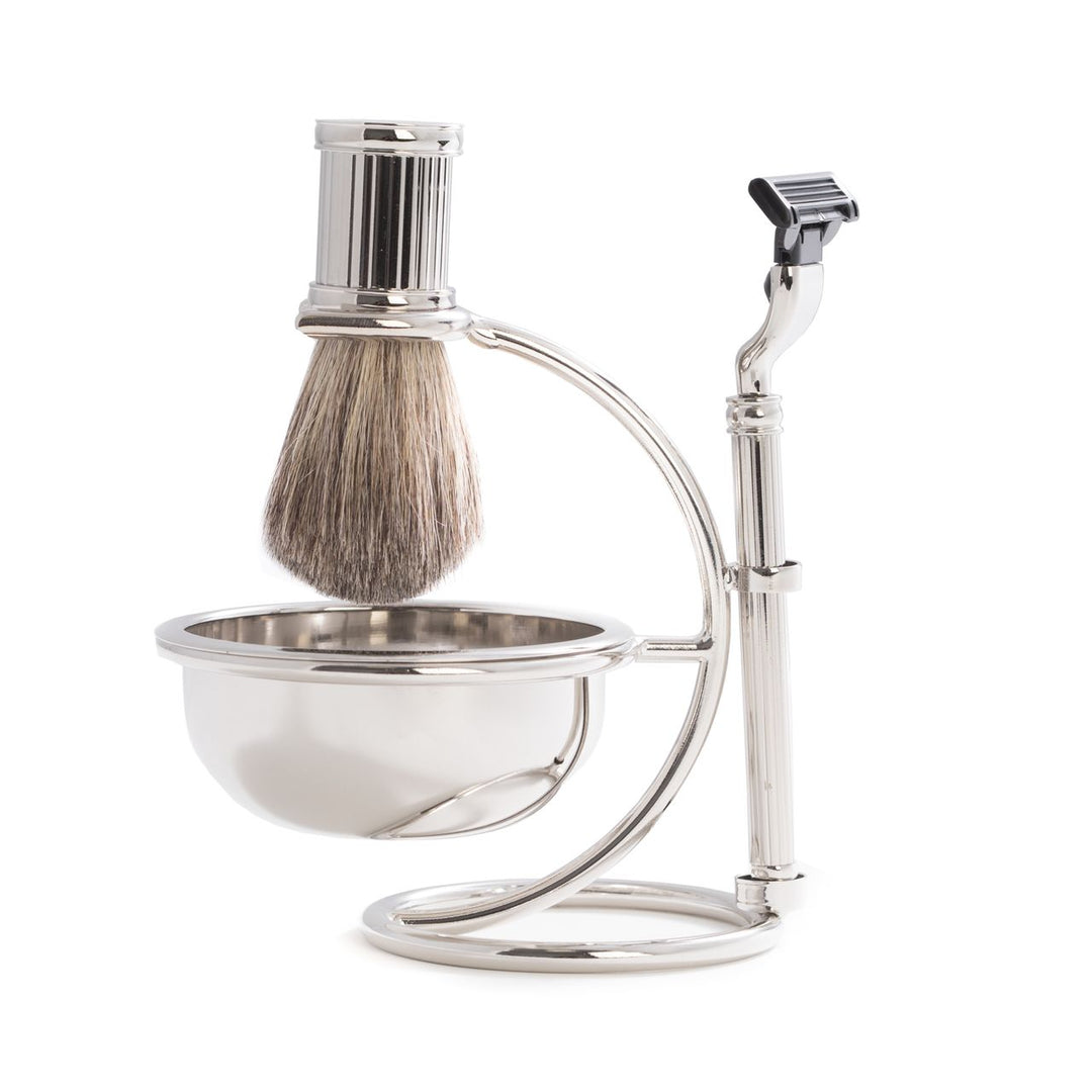 Side angle of chrome razor and badger brush shaving set with bowl and stand, polished silver finish for men’s wet shaving.
