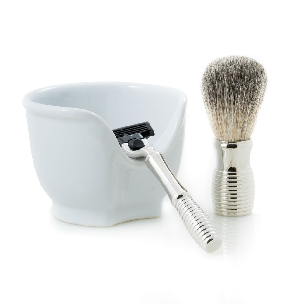 Chrome razor and badger brush with white porcelain soap bowl on white; coordinated shaving set, compact kit, Mach3 compatible