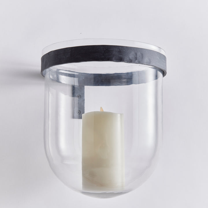 Clear glass wall candle holder with aged zinc band and LED candle, showing rounded vessel and wall mount in Modern Organic