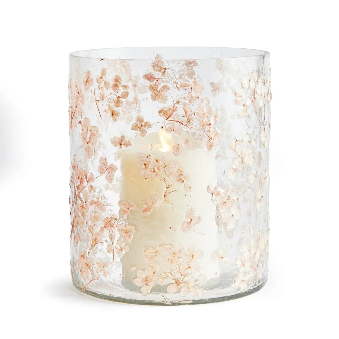 Large clear pink glass hurricane candle holder front view with preserved floral petals in textured glass, Romantic Transitional