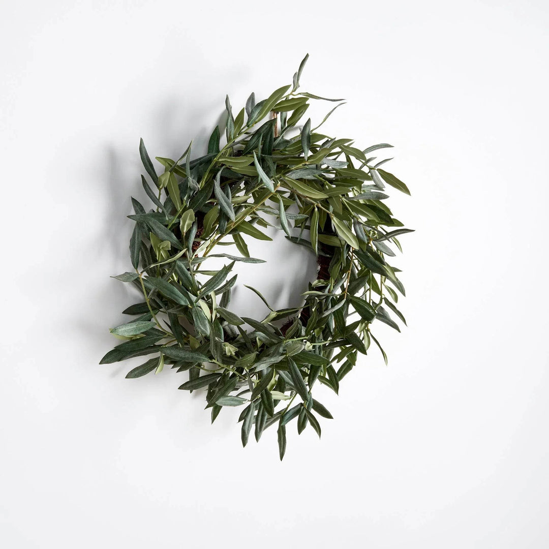 Round olive leaf wreath in farmhouse style, straight-on view showing natural green tones

