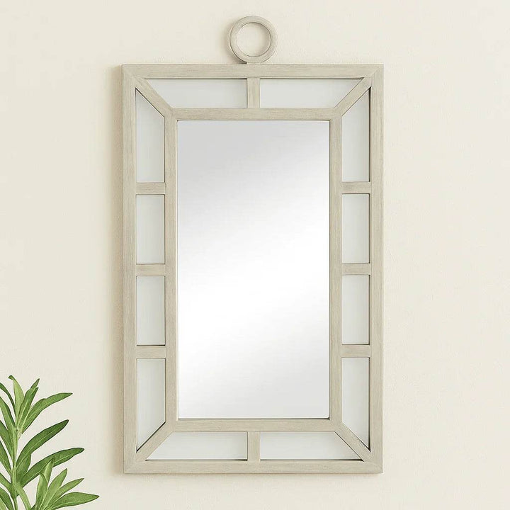 Coastal transitional rectangular wall mirror with whitewash finish styled in a neutral entryway setting

