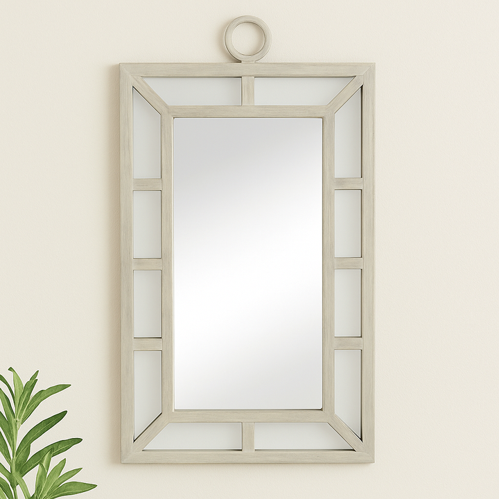 Coastal transitional rectangular wall mirror with whitewash finish styled in a neutral entryway setting


