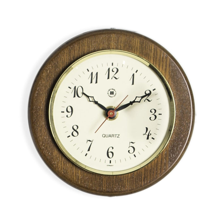 Compact cherry wood brass wall clock with cream dial shown alternate front view for traditional home office decor style