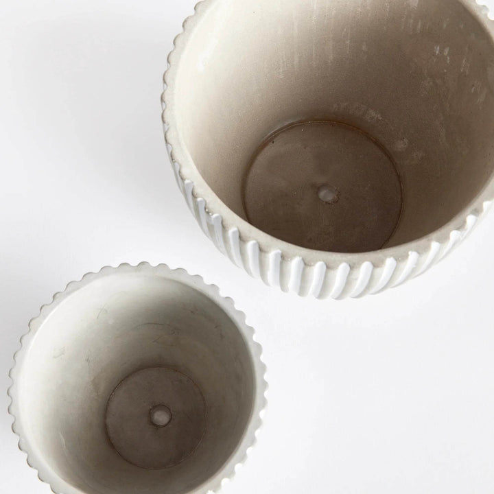 Top view of white concrete planter pots showing interior and built-in drainage holes for direct planting – Modern Organic.