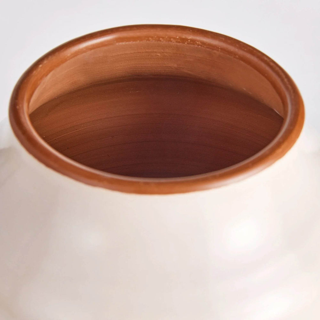 Close-up of shoulder and neck curve on cream ceramic vase highlighting subtle handmade asymmetry – Modern Organic