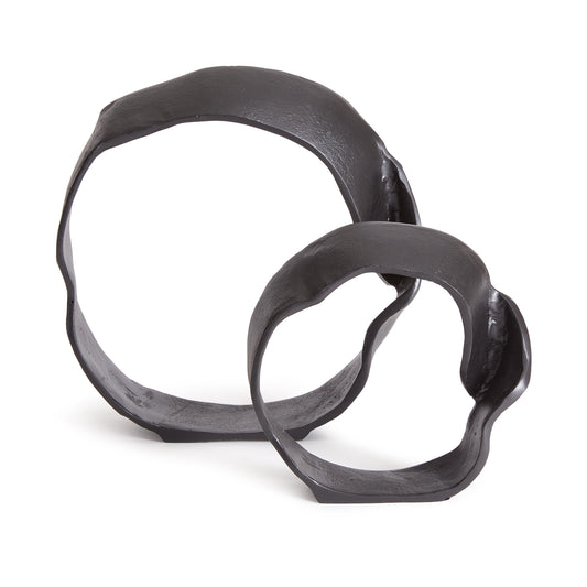 A matte black finish and rough, organic repeated circular shapes make these cast aluminum sculptures unique. A  contemporary touch for home office or den on book shelf, mantle or console.