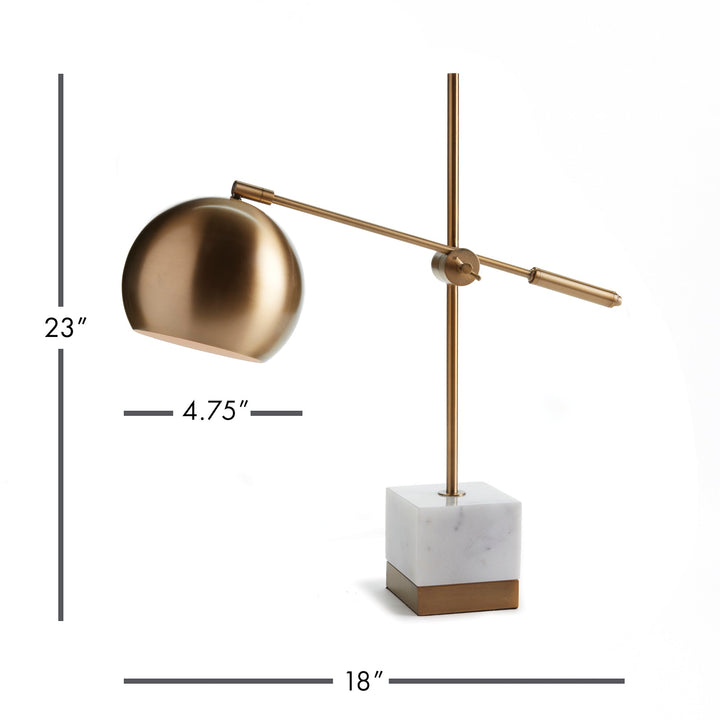 Utilizing a dual adjustable mechanism, the Graydon Desk Lamp offers a contemporary design for any space. Its brass finish and marble base add a touch of timeless sophistication.