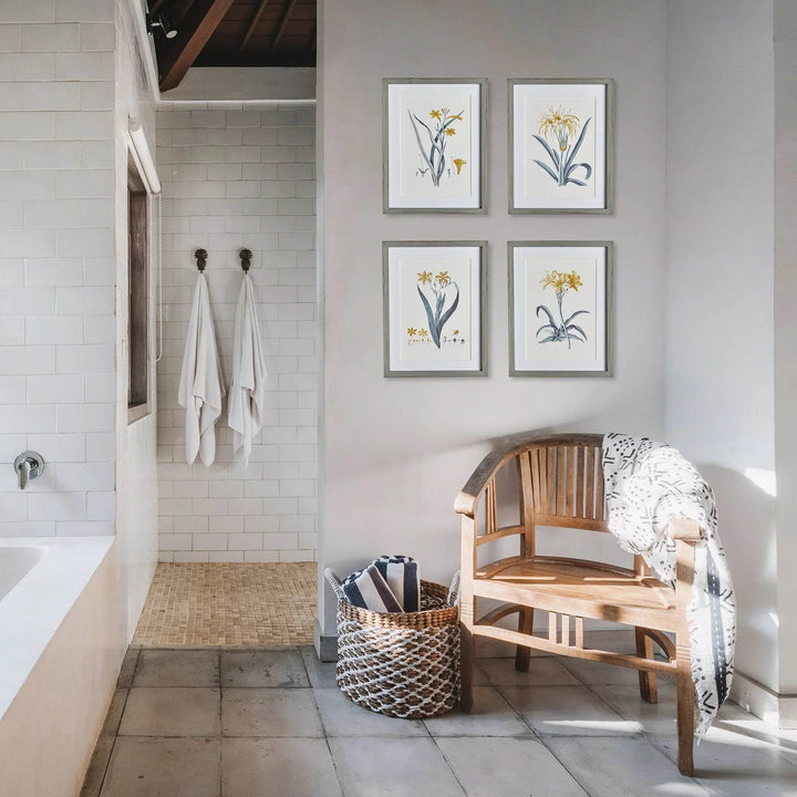 Framed daffodil art set styled above wooden bench in modern cottage bathroom with soft lighting – Modern Cottage.