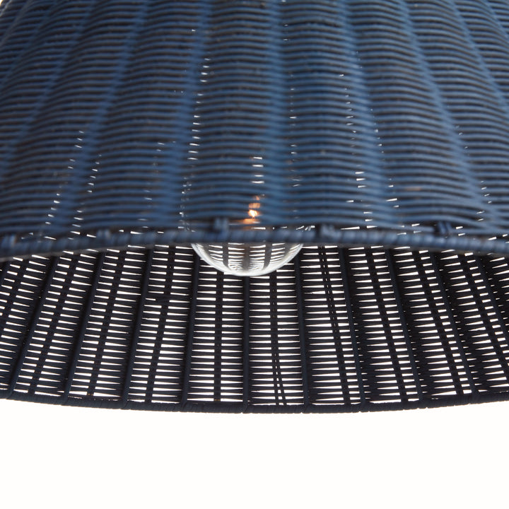 Close-up of a dark blue rattan pendant light on a white background
