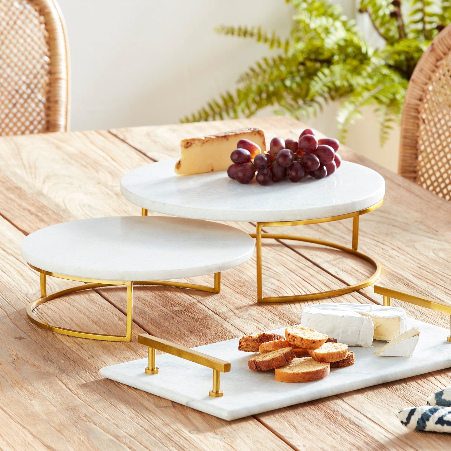 Enhance your serving experience with these sophisticated serving stands made from marble and brass, perfect for any occasion from coastal gatherings to traditional or transitional settings. The combination of marble and brass adds a touch of elegance to your favorite cheese and cracker spreads. Versatile yet timeless, these stands are a must-have for your serving collection.