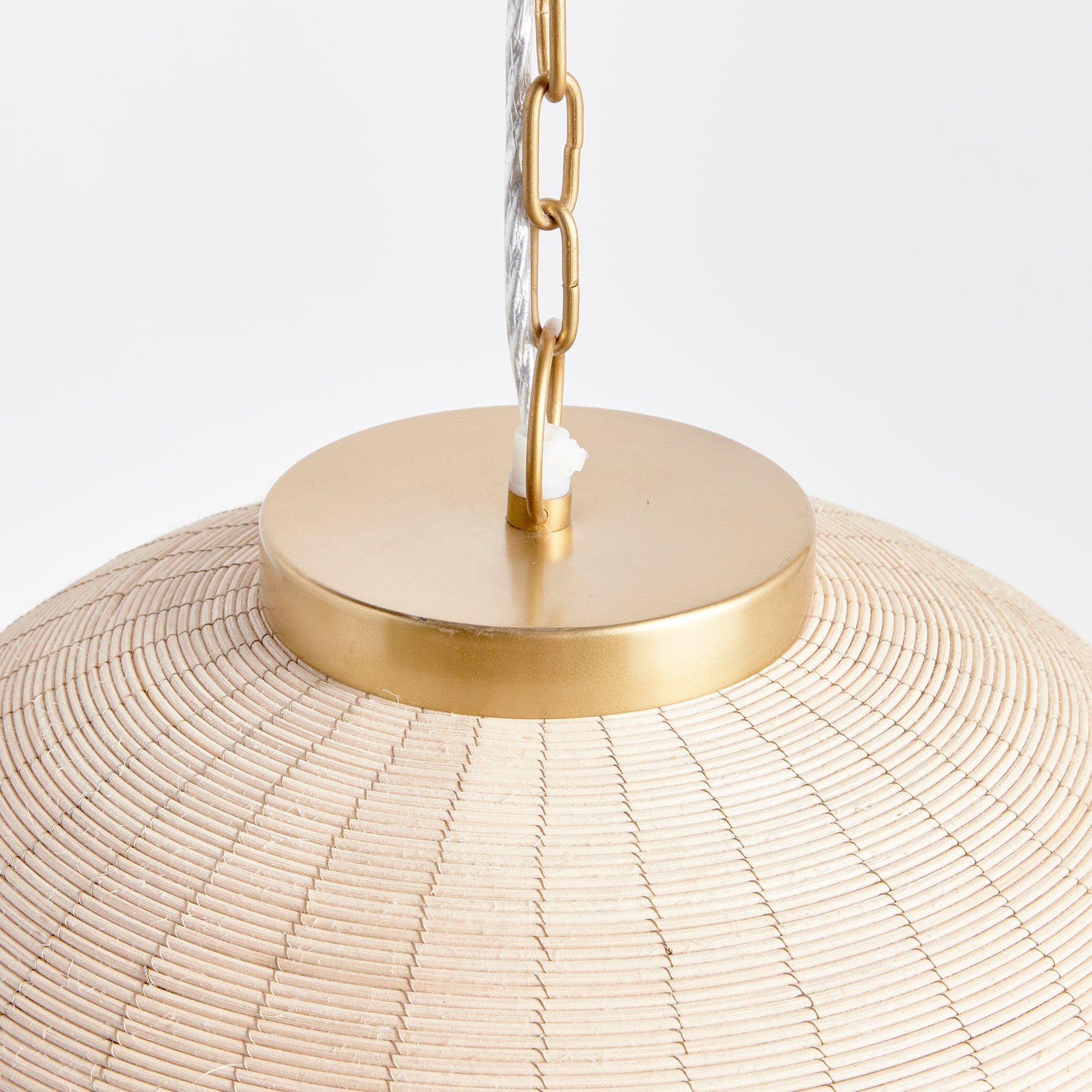 Crafted from natural cane rattan, the Maye Dome Pendant Light boasts a distinctive blend of colors, creating one-of-a-kind pieces. With elegant brass accents at the top and bottom, this pendant adds a refined touch to any space. Its impressive size makes it a statement piece for kitchen islands, entryways, or hallways, elevating the overall look of your room.