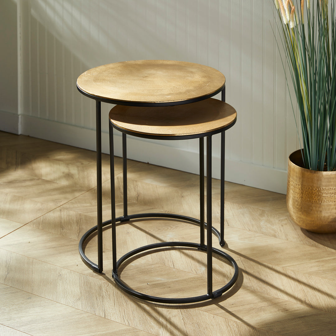 Expertly designed with durable cast aluminum construction and intricate patterns, the Alamar Gold &amp; Bronze Side Tables make a stunning addition to any living space. Featuring an elegant outer band of rich bronze, these nesting tables are perfect for placement near a sofa or in a small foyer for both aesthetic and functional purposes.