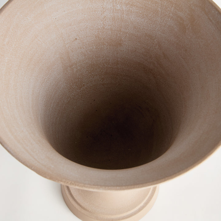 Interior detail of decorative pedestal urn showing the smooth vessel opening and sandstone-look finish, Modern Organic style