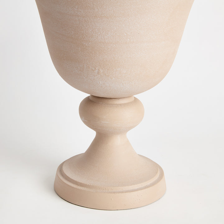 Rear view of decorative pedestal urn with sandstone-look finish showcasing the rounded vessel and pedestal design, Modern Organic style