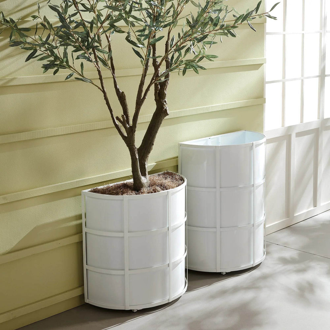 Pair of white iron demilune planters styled on a patio, blending transitional and contemporary outdoor aesthetics.