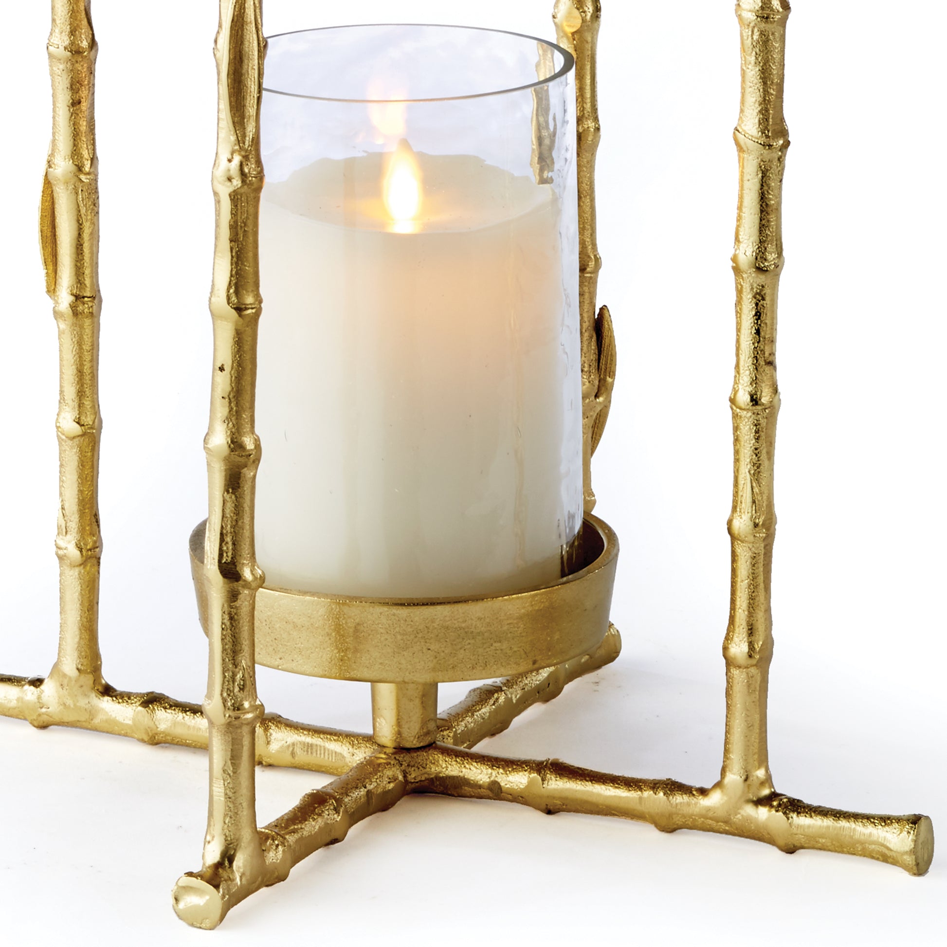 With its elegant gold bamboo design and beautiful seeded glass insert, this lantern is the perfect addition to any space. Its loop feature adds both height and sophistication, creating an elegant focal point that draws the eye upward.